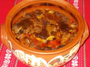 Steaks with Mushrooms and Sauce in Clay Pot