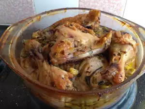 Chicken Legs in a Glass Cook Pot with Onions