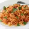 Tomates con arroz y pollo al horno