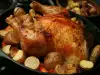 Chicken Stuffed with Rice and Garnished with Potatoes