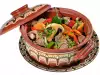 Clay pot dish with mushrooms and hot peppers